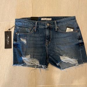 Denim shorts with a distressed look. Brand nee never worn.